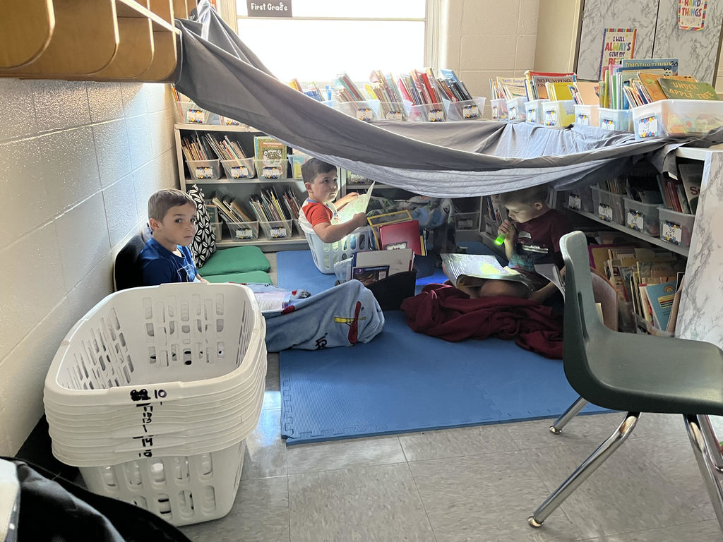 student reading with a flashlight