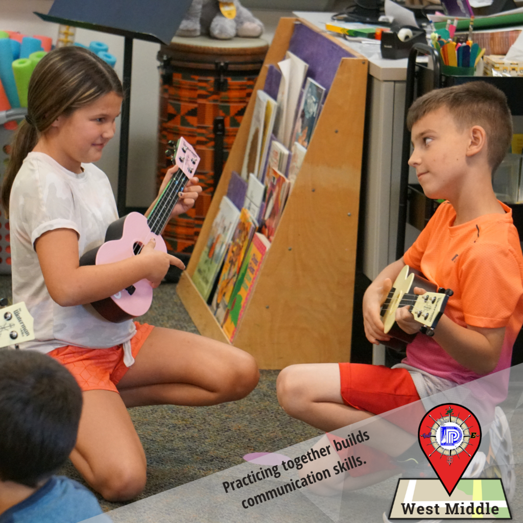 Working in pairs to play ukulele builds communication skills