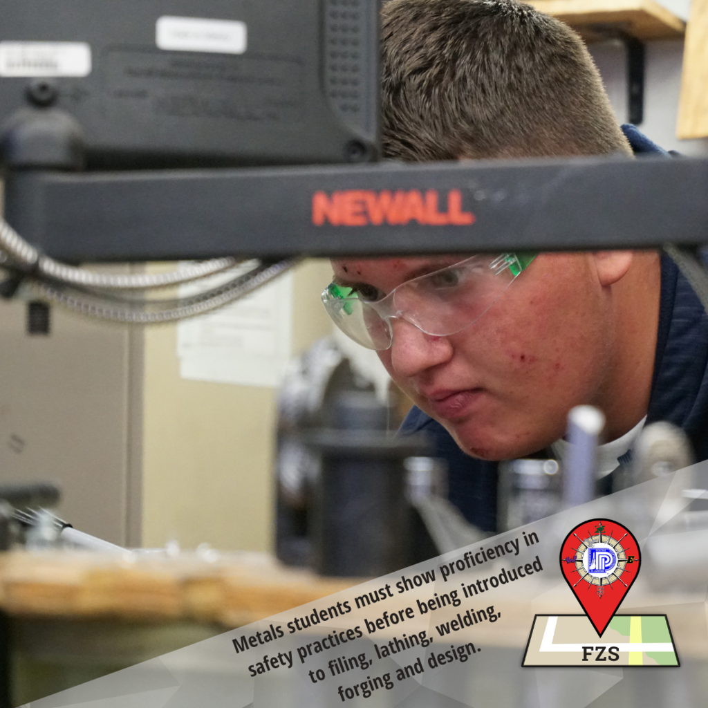 Metals students must show proficiency in safety practices before being introduced to filing, lathing (shown here) welding, forging and design.