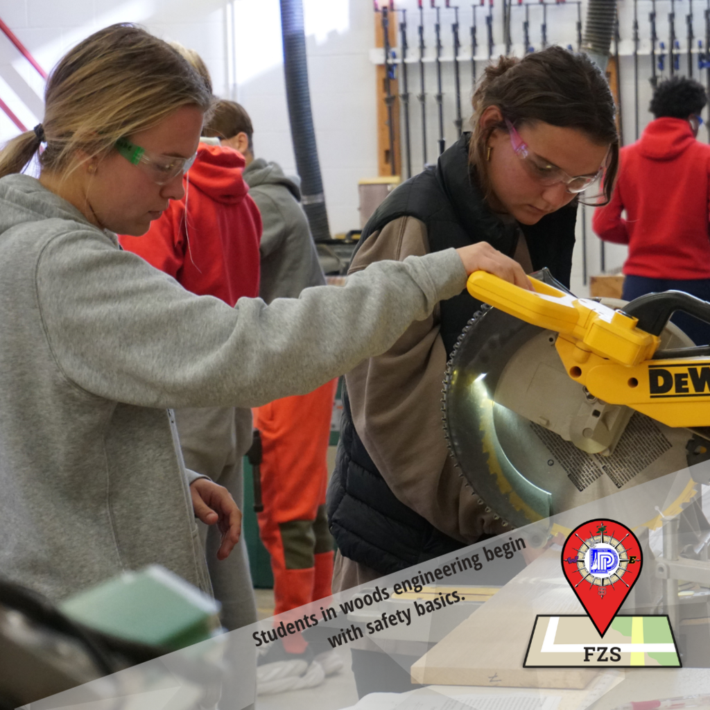 Students in woods engineering begin with safety basics before operating equipment such as this table saw.