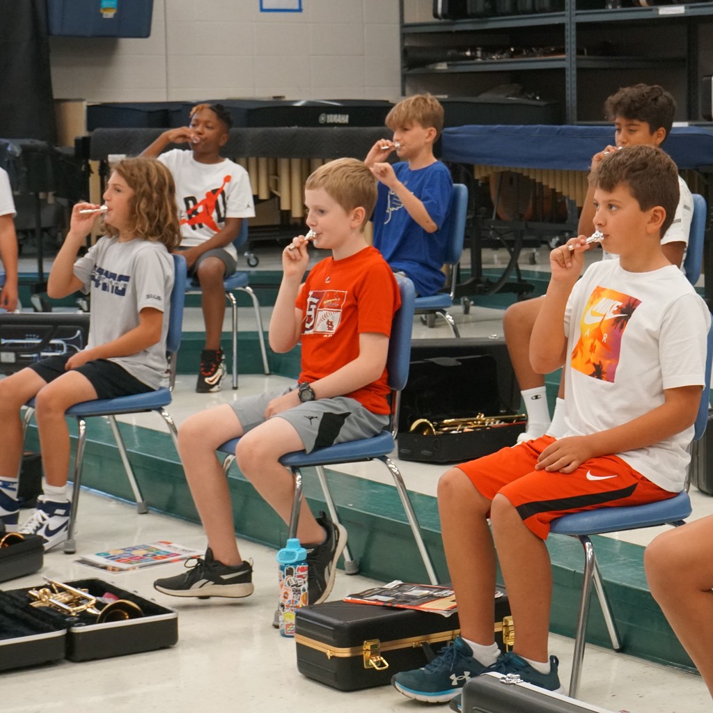 Sixth grade trumpet players set to work learning to buzz their mouthpiece the first week of school